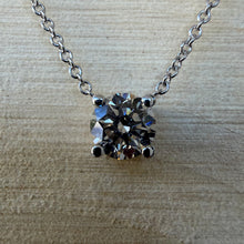 Load image into Gallery viewer, Necklace in 14 ct. white gold holding one 0,50 ct. natural diamond
