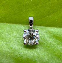 Load image into Gallery viewer, Pendant in 14 ct. white gold holding one 0,50 ct. natural diamond