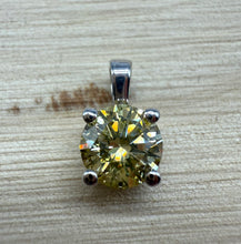 Load image into Gallery viewer, Pendant in 14 ct. white gold holding one 0,52 ct. natural diamond
