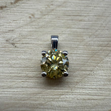 Load image into Gallery viewer, Pendant in 14 ct. white gold holding one 0,52 ct. natural diamond
