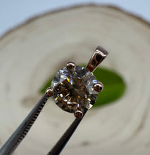 Load image into Gallery viewer, Pendant in 14 ct. rose gold holding one 0,51 ct. natural diamond
