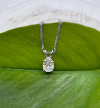 Load image into Gallery viewer, Necklace in 14 ct. white gold with a 0,82 ct. diamond pendant.
