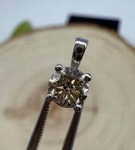 Load image into Gallery viewer, Pendant in 14 ct. white gold holding one 0,50 ct. natural diamond
