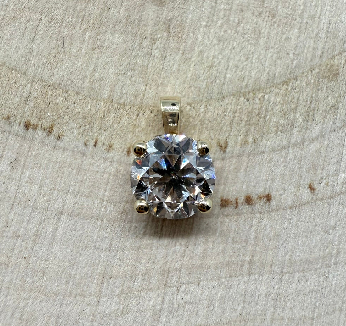 14 ct. gold pendant with 1,00 ct. natural diamond