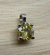 Load image into Gallery viewer, Pendant in 14 ct. white gold holding one 0,52 ct. natural diamond
