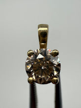 Load image into Gallery viewer, Pendant in 14 ct. gold holding one 0,50 ct. natural diamond
