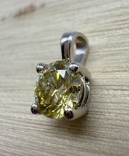 Load image into Gallery viewer, Pendant in 14 ct. white gold holding one 0,52 ct. natural diamond
