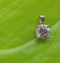 Load and play video in Gallery viewer, Pendant in 14 ct. gold holding one 0,50 ct. natural diamond

