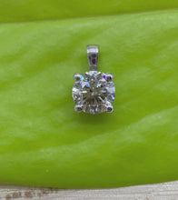 Load and play video in Gallery viewer, 14 ct. white gold pendant with a 0,60 ct. natural diamond
