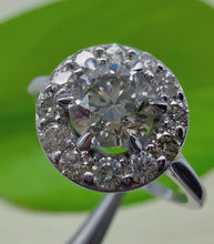 Load and play video in Gallery viewer, Halo ring in 14 ct. white gold holding 0,96 tcw. natural diamonds
