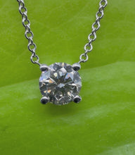 Load and play video in Gallery viewer, Necklace in 14 ct. white gold holding one 0,50 ct. natural diamond
