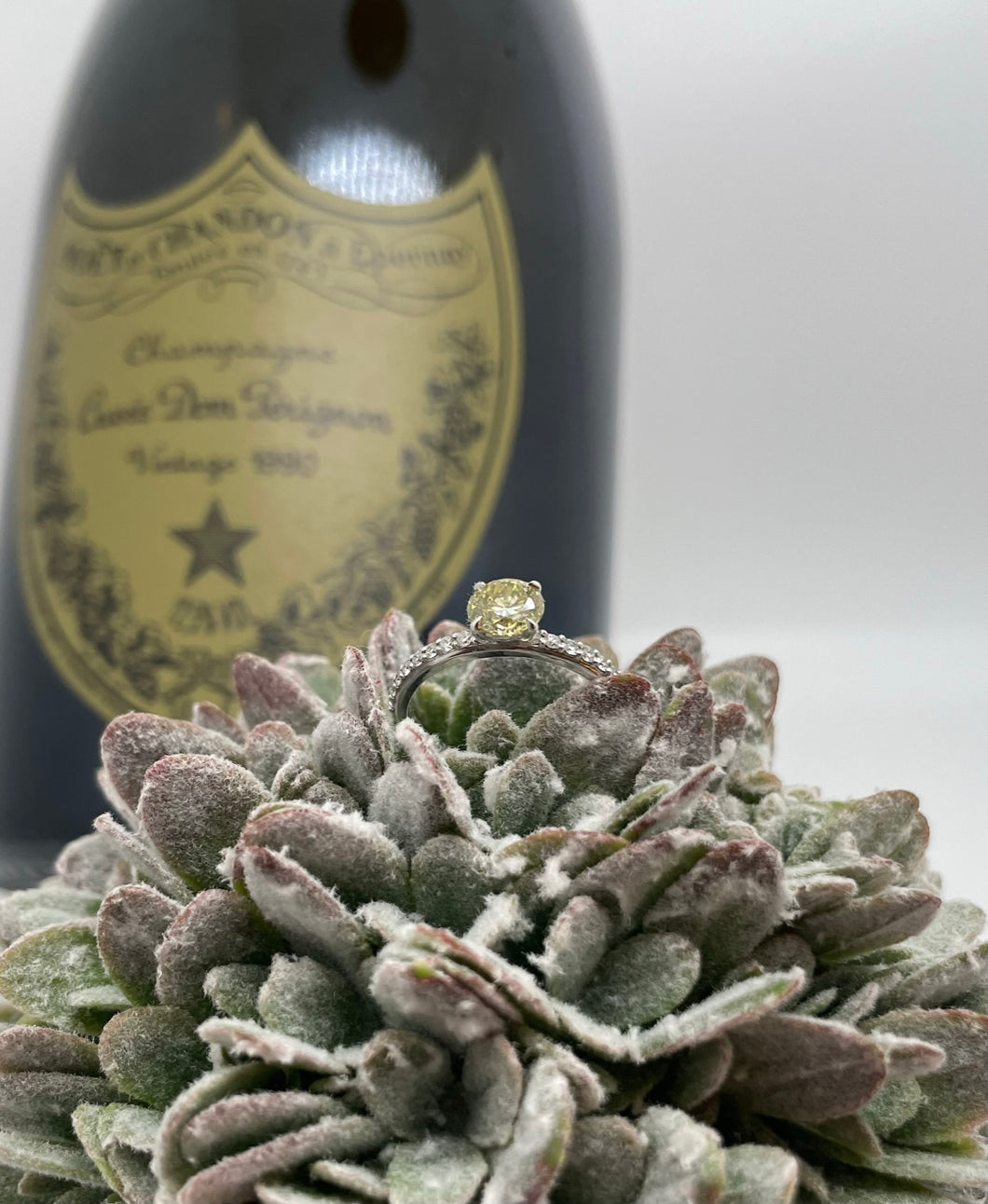 White gold ring with an intense yellow diamond