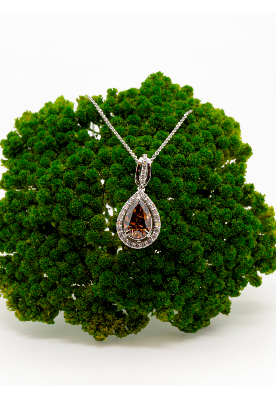 White gold chain with a stunning teardrop-shaped yellow-brown diamond